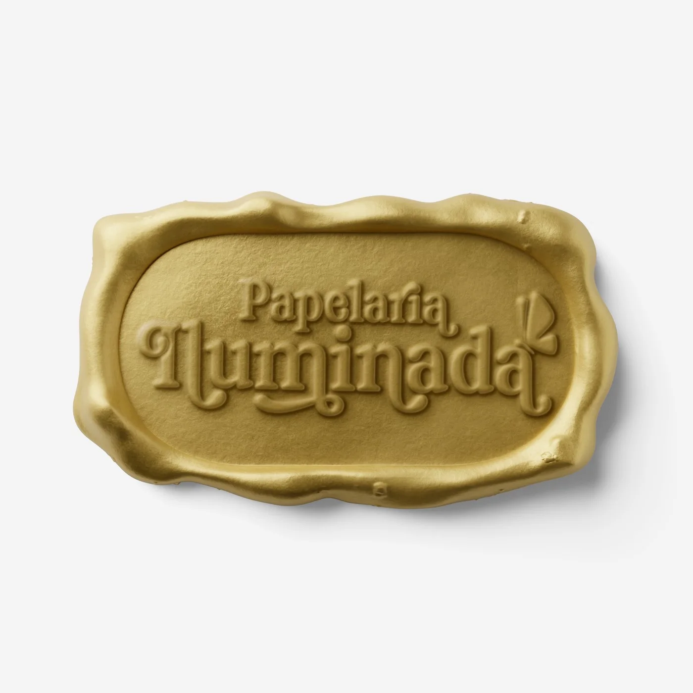 Carimbo retangular dourado com o logotipo Papelaria Iluminada
